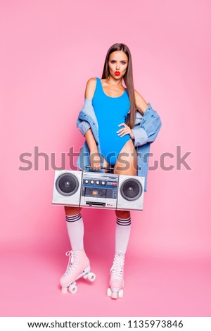 Old-school people person glamour leisure lifestyle concept. Vertical full length size studio photo portrait of beautiful brunette hair girl holding tape cassette radio isolated color bright background