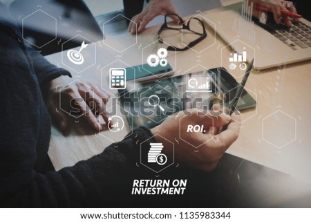 ROI Return on Investment indicator in virtual dashboard for improving business. Business team meeting present. Photo professional investor working with new startup project. Finance managers meeting.
