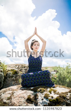 woman meditating in nature