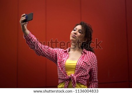 Young american woman taking selfie in New york, Time square