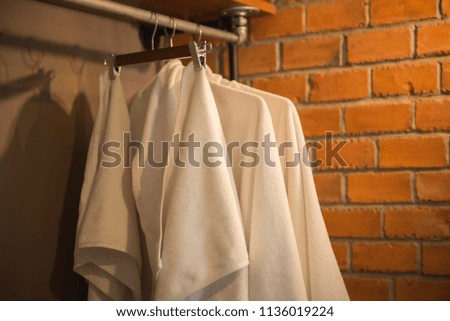White towel hangs on the rail.
