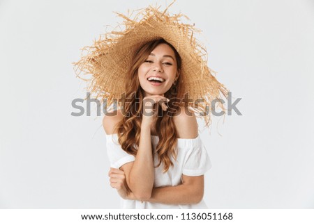 Portrait closeup of happy young woman 20s wearing big straw hat posing on camera with lovely smile isolated over white background