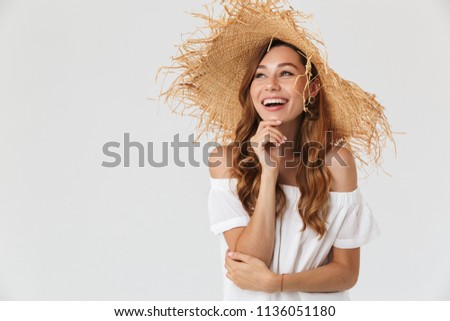 Photo closeup of elegant woman 20s wearing big straw hat laughing and looking aside at copyspace isolated over white background