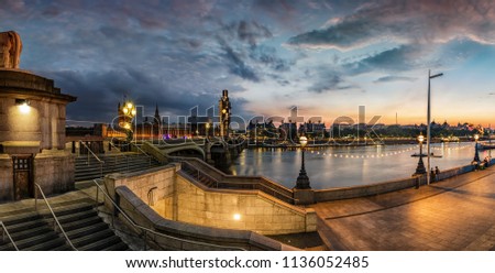 Panoramic view of the Westminster Bridge and Big Ben clock tower under construction during a summer sunset night, London, United Kingdom