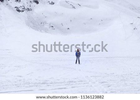 Asian tourists play ski  at zero point of kashmir, India.