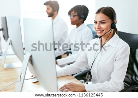 Call Center Agent Ð¡onsulting Client Online  Royalty-Free Stock Photo #1136125445