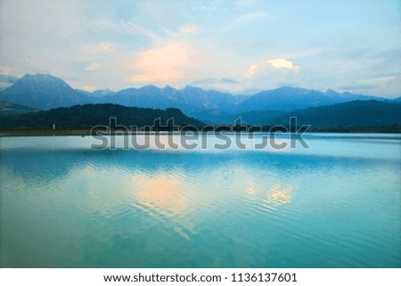 calm lake in the mountains at sunset