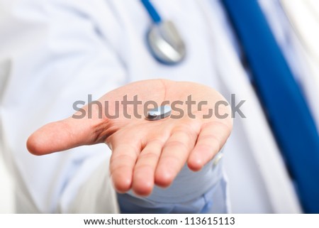  Doctor giving you a pill Royalty-Free Stock Photo #113615113