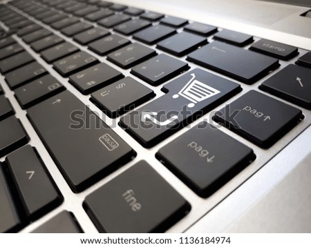 online shopping or internet shop concepts, with shopping cart symbol on keyboard
