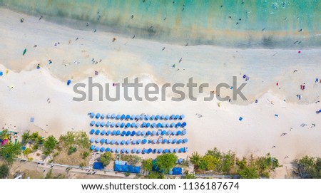 Top view sunbathing tourists beautiful sandy beach and umbrella 