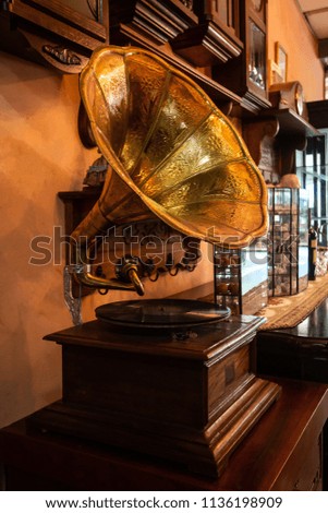 old gold gramophone with music turntable object , phonograph vintage style . 