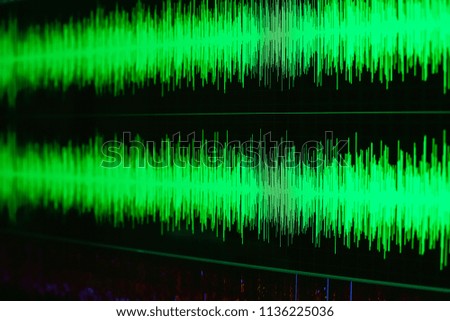 Sound waves oscillating dark green light