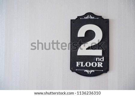 2nd floor sign symbol with white letter on black wood on white background hotel