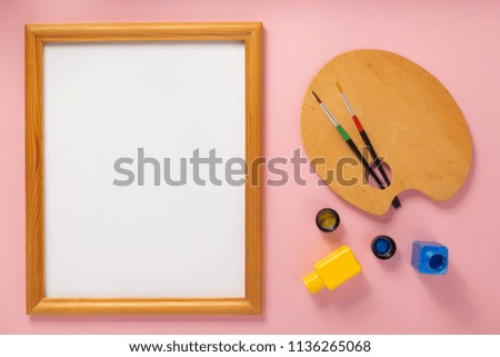palette and picture frame on abstract background
