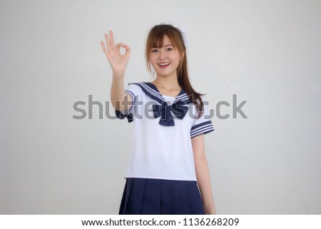 Portrait of thai teen beautiful girl in japanese student uniform ok