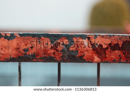 Macro photograph of a bright red and black rusty abstract background 