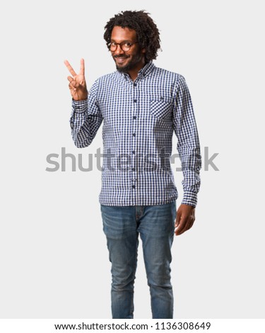 Handsome business african american man fun and happy, positive and natural, makes a gesture of victory, peace concept