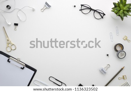 Home office desk workspace with office accessories on white background.