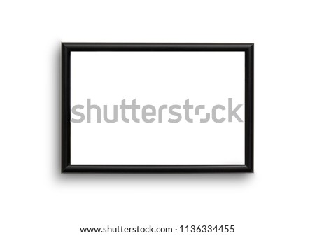 black rectangular 2x3 frame hanging on the wall isolated on a white background