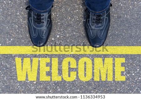 Feet on the street with text WELCOME