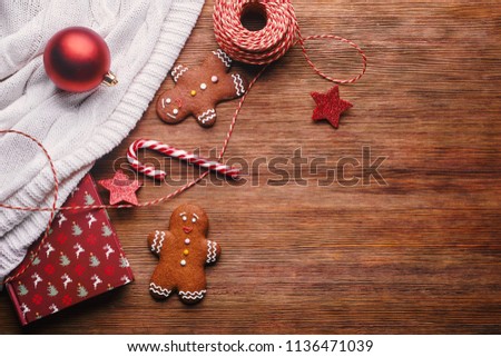 gingerman cookies, lollipop, christmas decoration on wooden backgorun