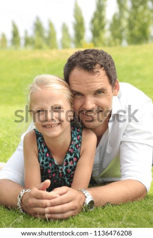 Happy father and daughter outside