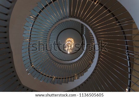 Spiral staircase view looking upward.