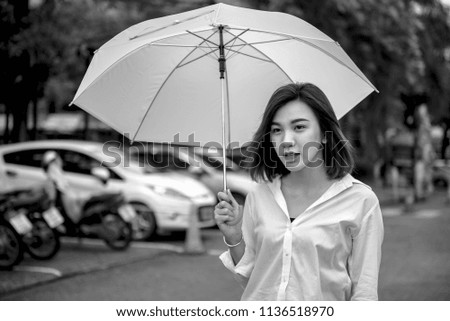 Asian women with umbrella.