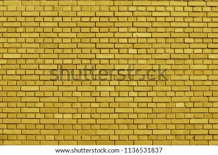 Ceylon Yellow colored brick wall background