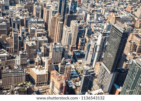 Cityscape of various buildings, skyscrapers and architecture looking down on midtown Manhattan in New York City