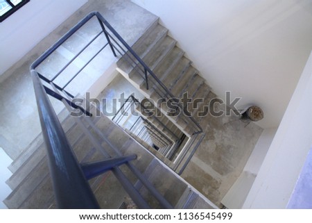Picture of External fire escape staircase , external emergency exit at an industrial building,Fire escape behind a tall building