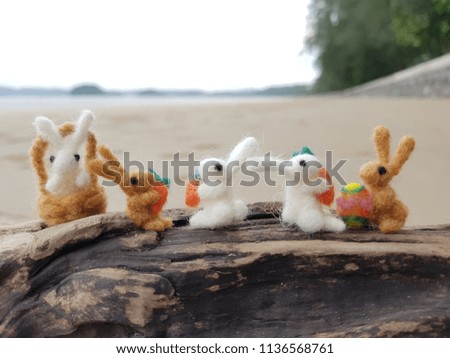 The family of little rabbit is sitting on the beach