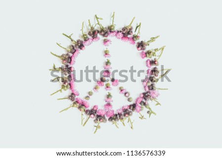 Peace sign (Pacific)-a symbol of peace, disarmament and anti-war movement, lined with delicate pink flowers blossomed Thistle.