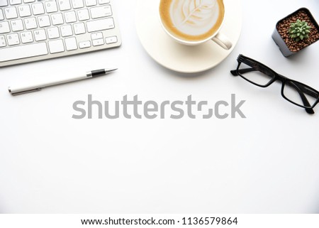 Top view with copy space, working desk with laptop,cell phone,notebook pencil and coffee on white background