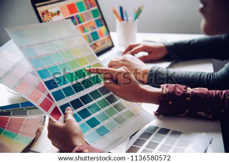 designer graphic creative ,creativity woman  working on laptop and designing  coloring color ideas style