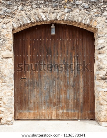 The large ancient wooden door in Spain.