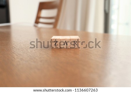 ZAR (South African Rand) Text Block on Wooden Table