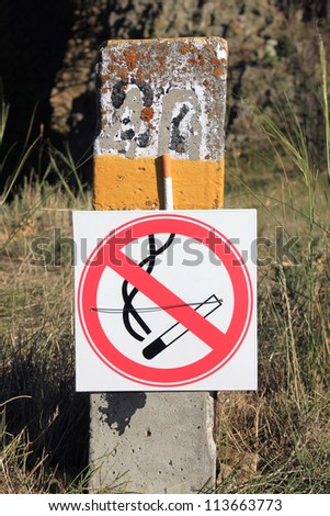 No smoking. Signs on pillar