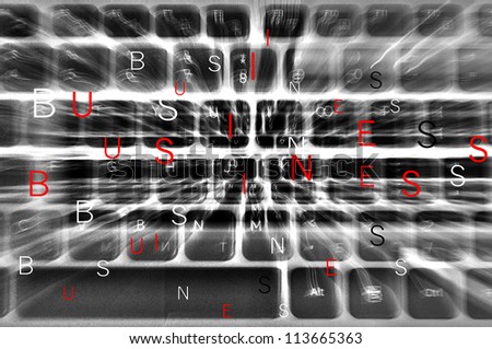 Keyboard in  motion blur effect in background with flying white and red letters forming word "business"