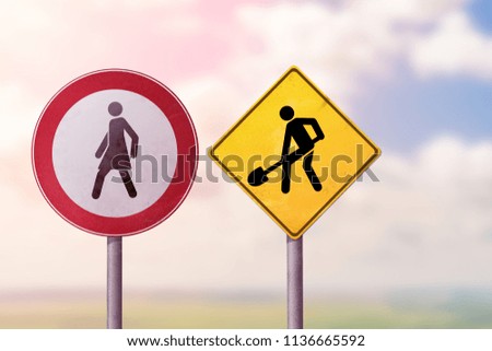 Workaholism and idleness, freedom and slavery - a woman goes away from a working man. Road signs.