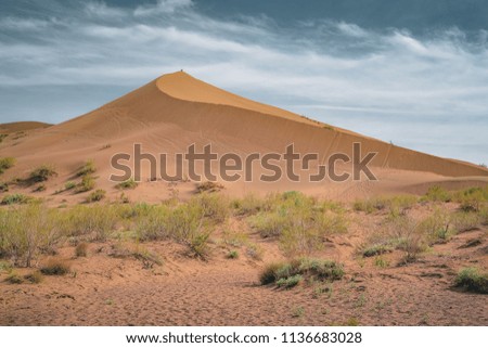 Sand dunes under blue sky. Sahara Desert, Previously, village houses transferred due to sands movement.