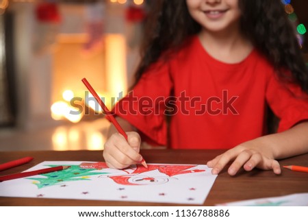 Little child drawing picture at home. Christmas celebration