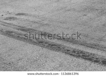 black tire tracks on racing track or asphalt