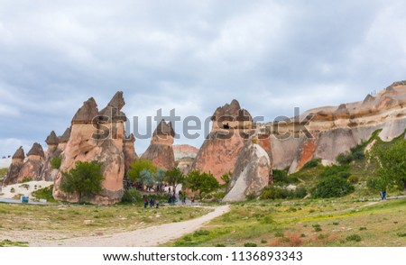 Fairy Chimneys with beautiful old rock formations in Cappadocia, Goreme, Nevsehir, Turkey. Holiday, travel and vacation in Cappadocia Turkey.