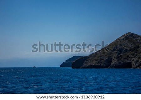 Photo of the ocean and mountains. Marine landscape photography in blue colors