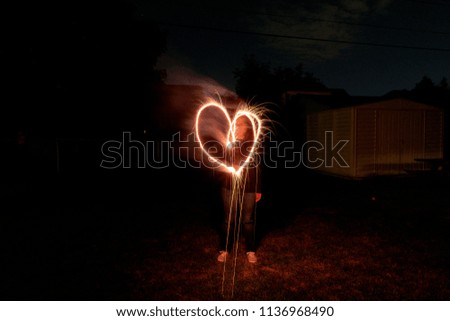 Heart Shape with sparkler at night