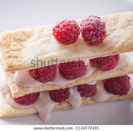 
Raspberry mille feuille dessert on white background
