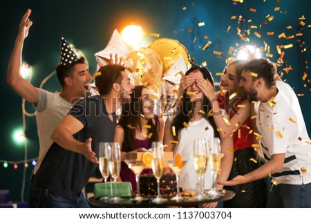 Young people at birthday party in club