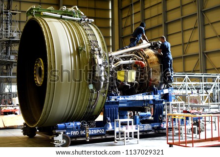 Jet engine remove from aircraft (airplane) for maintenance at aircraft hangar.Jet engine maintenance and change part by aircraft technician . Royalty-Free Stock Photo #1137029321