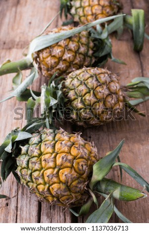 pineapple on wooden table background